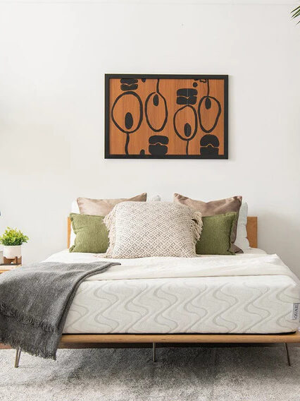 A bed set with a Nest mattress on the frame. 
